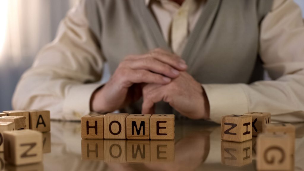 Scrabble blocks spelling out home.