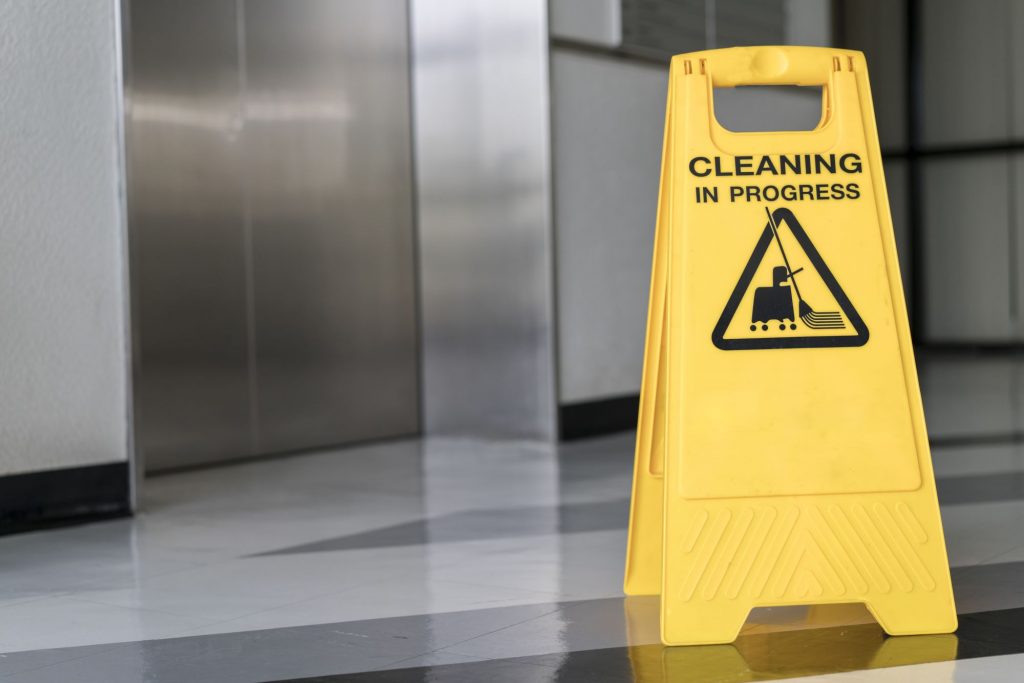 "cleaning in progress" sign on wet floor