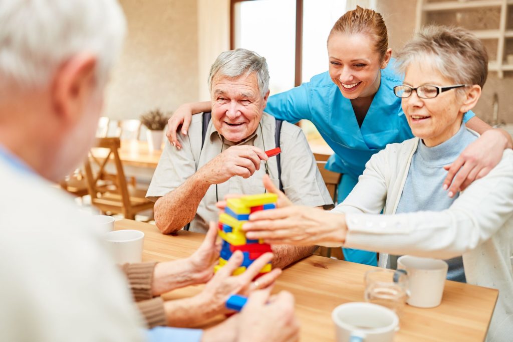 social adult day care playing Jenga in a group