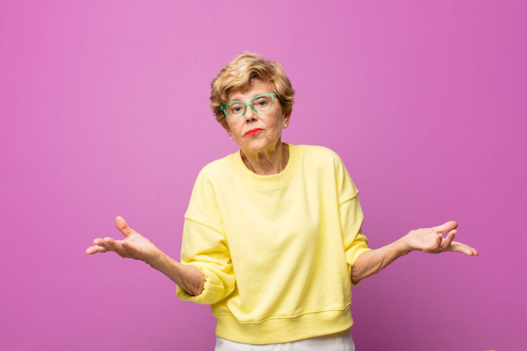 Elderly woman shrugging at the question, what are the 3 main types of home care