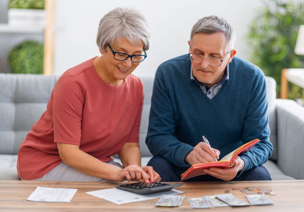 senior couple calculating finances together