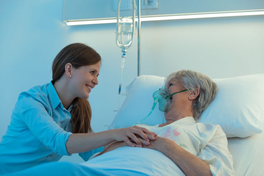 volunteer with hospice patient, comforting