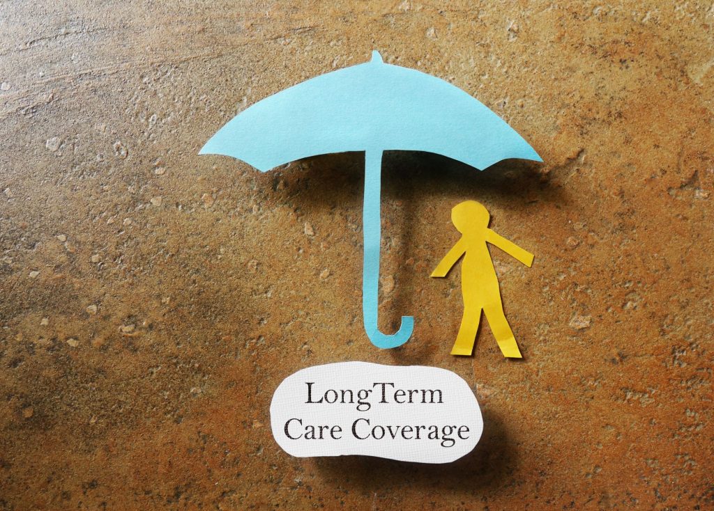 Long-Term Care Coverage umbrella and stick figure person