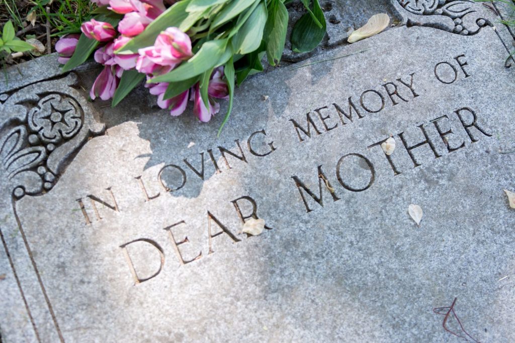 How to Sell Unwanted Burial Plots head stone with "in loving memory of dear mother" written