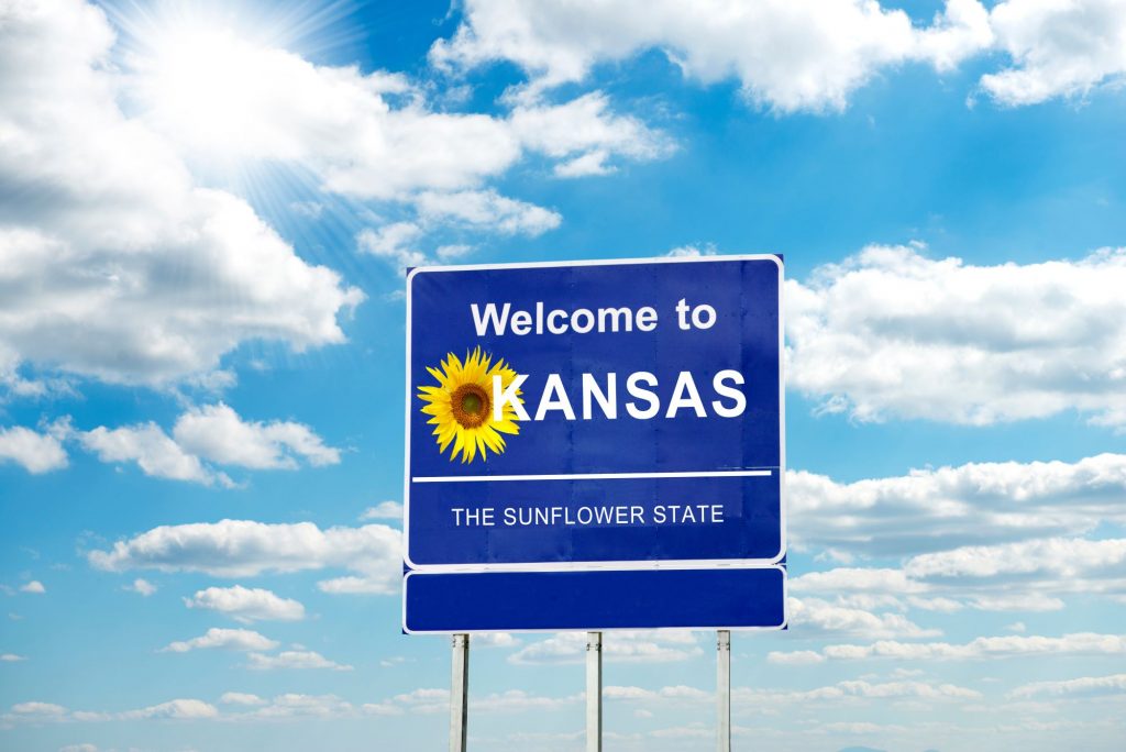 Welcome to Kansas street sign with slogan "the sunflower state"