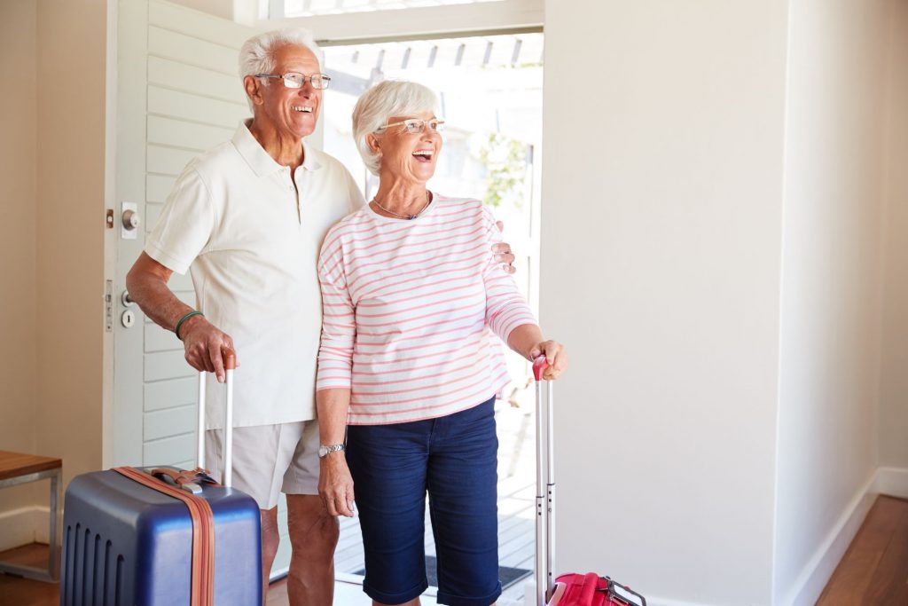 How to Handle Your Medicare Coverage if You Move senior couple who just arrived in their brand new home after moving