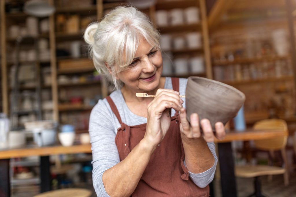 senior woman doing pottery