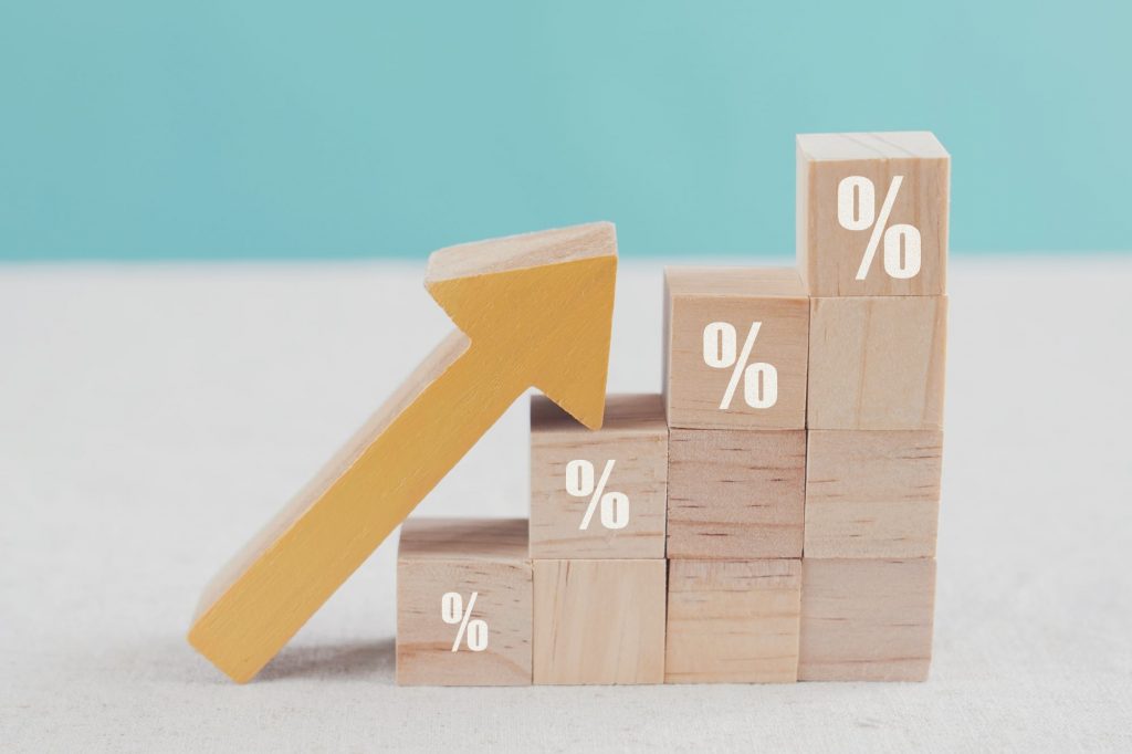 blocks and arrow depicting rising tax percentages, property tax