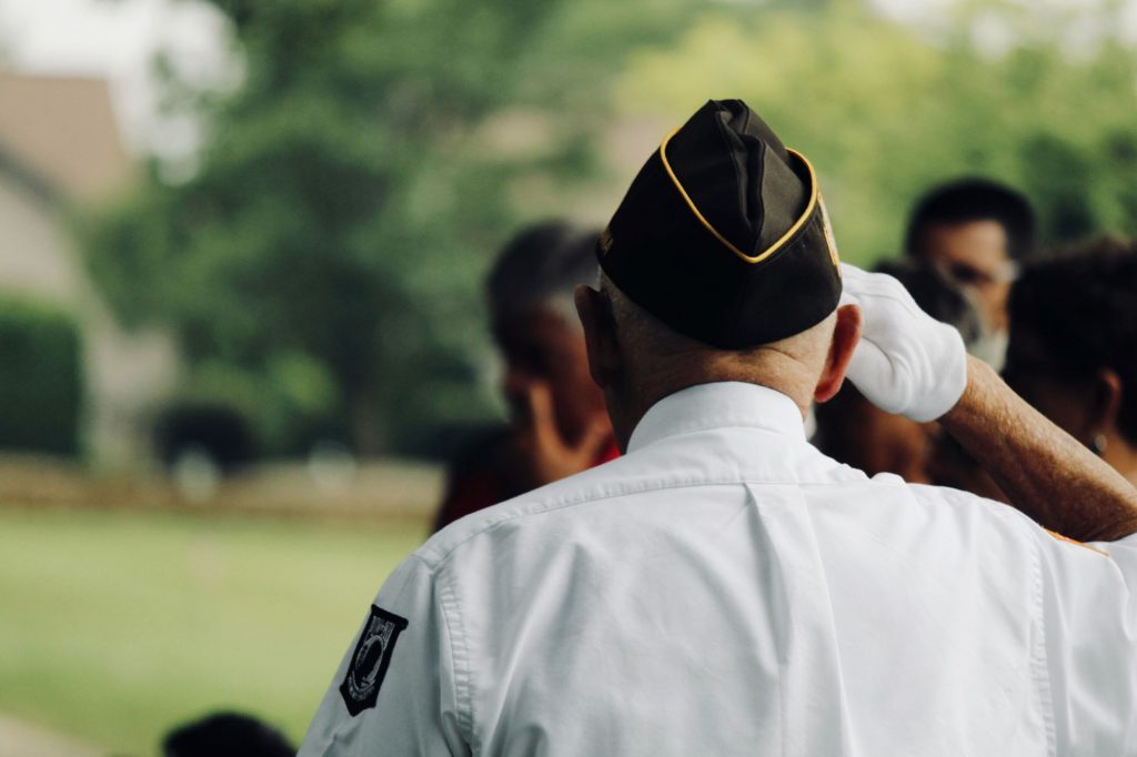 senior veterans on Veteran's Day, November 11, saluting