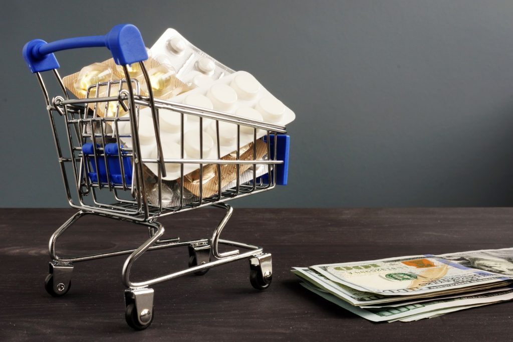 medication in a shopping cart next to money - what are guaranteed issue rights?
