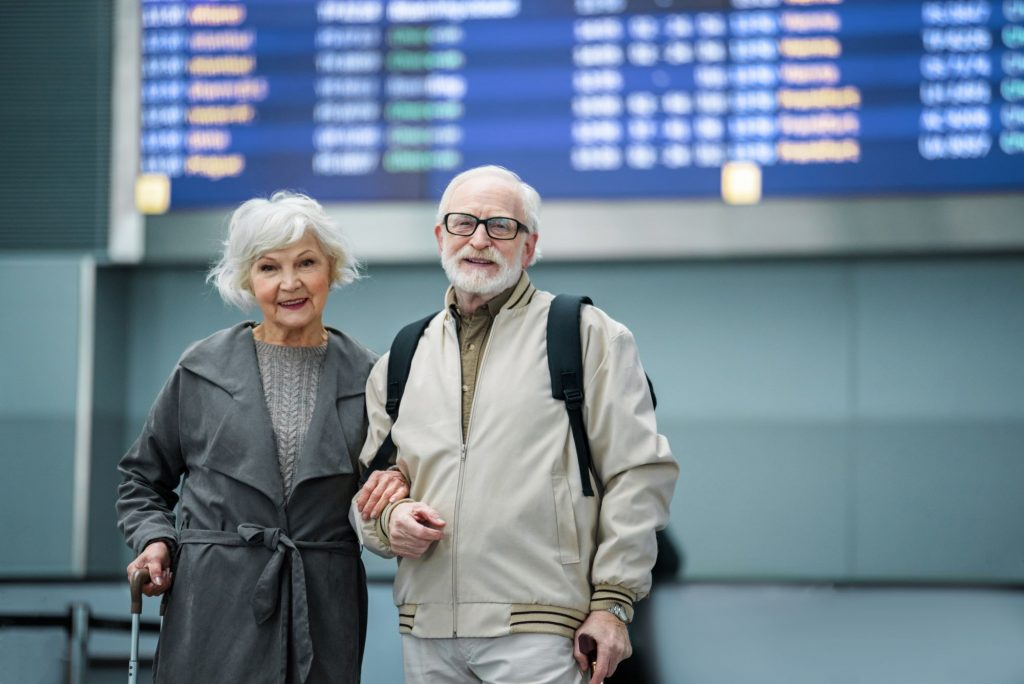 senior couple at airport for relocation
