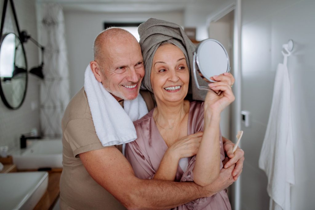 bathroom and shower selfie couple, two retirees smiling