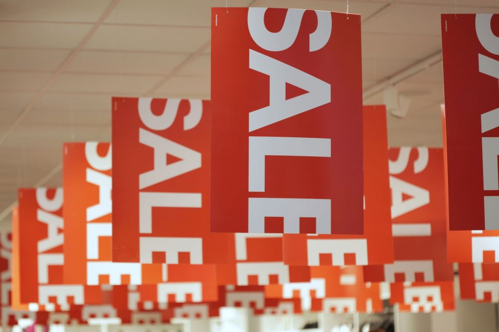 sale signs in a new clothes store