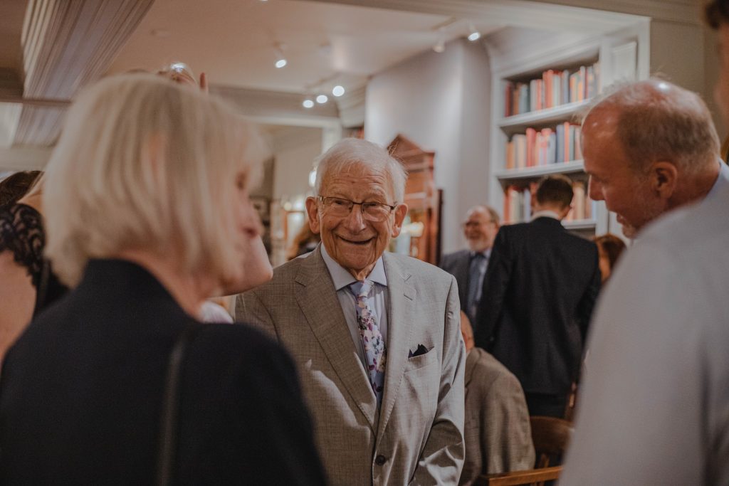older gentleman in suit at party