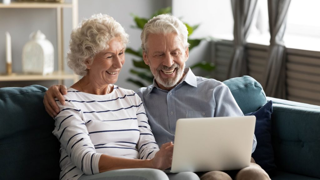 two seniors on a computer