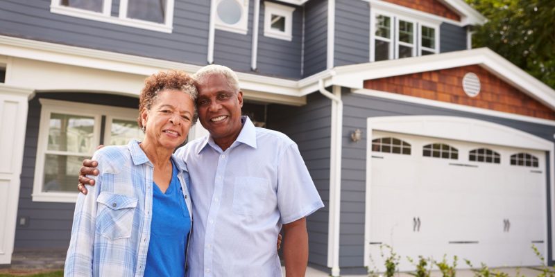 senior couple outside of house