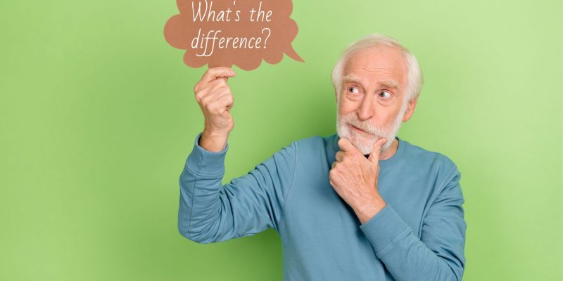 man holding a sign saying what's the difference?