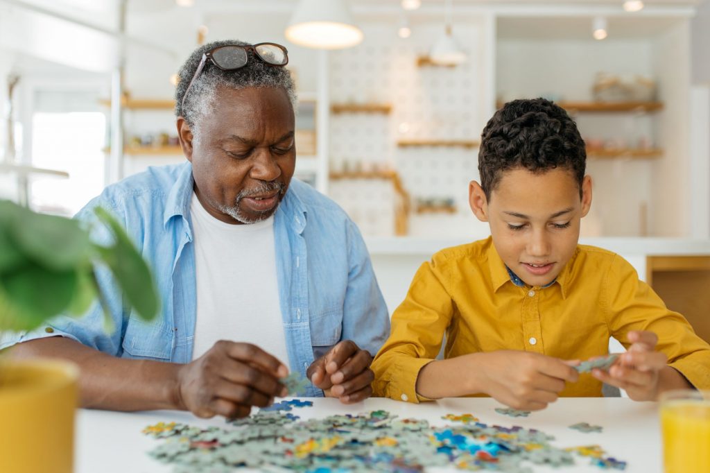 grandpa and grandson doing puzzle