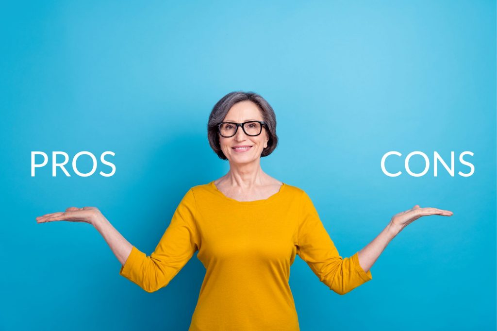 woman presenting pros and cons of assisted living in words