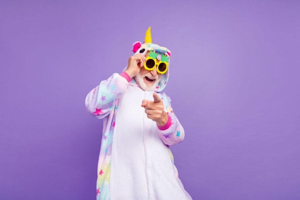 old senior in unicorn onsie