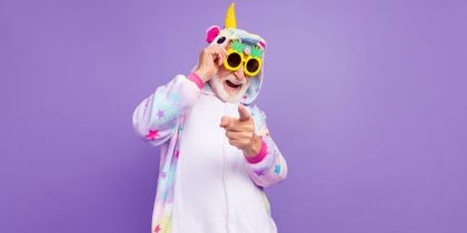 old man wearing a unicorn onsie