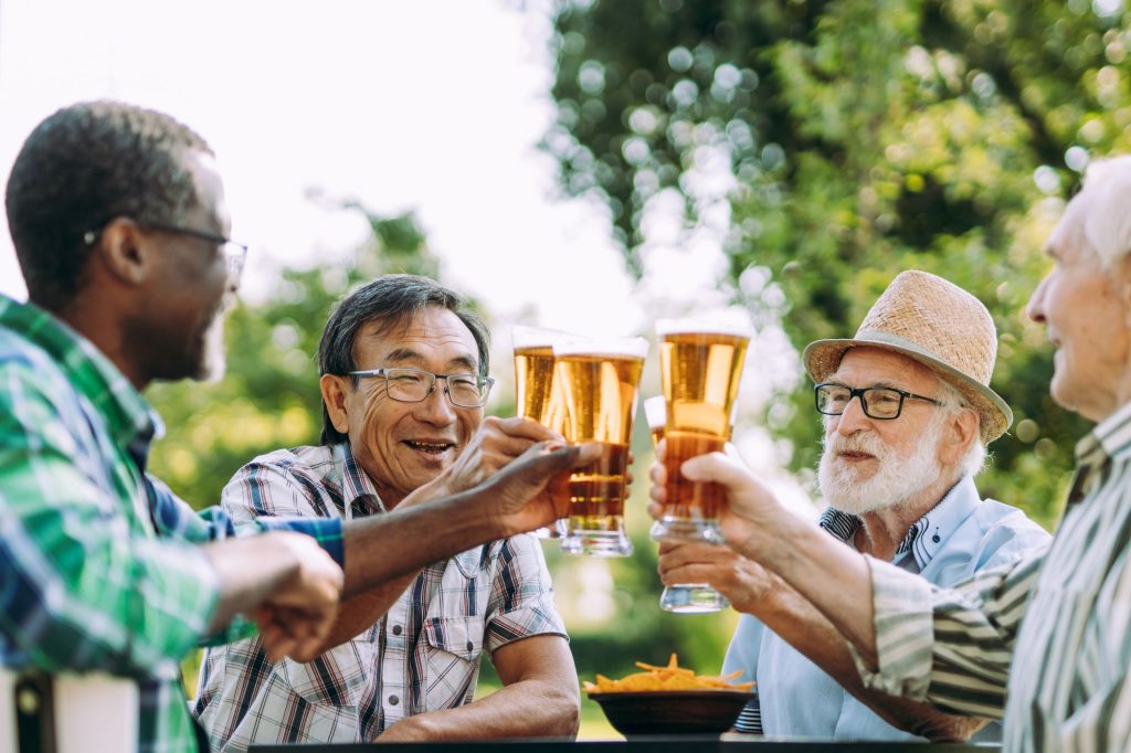 seniors drinking beer and eating chips