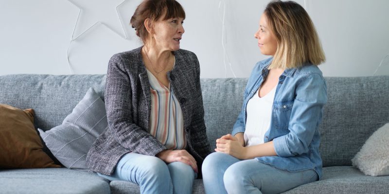 adult child talking with mom