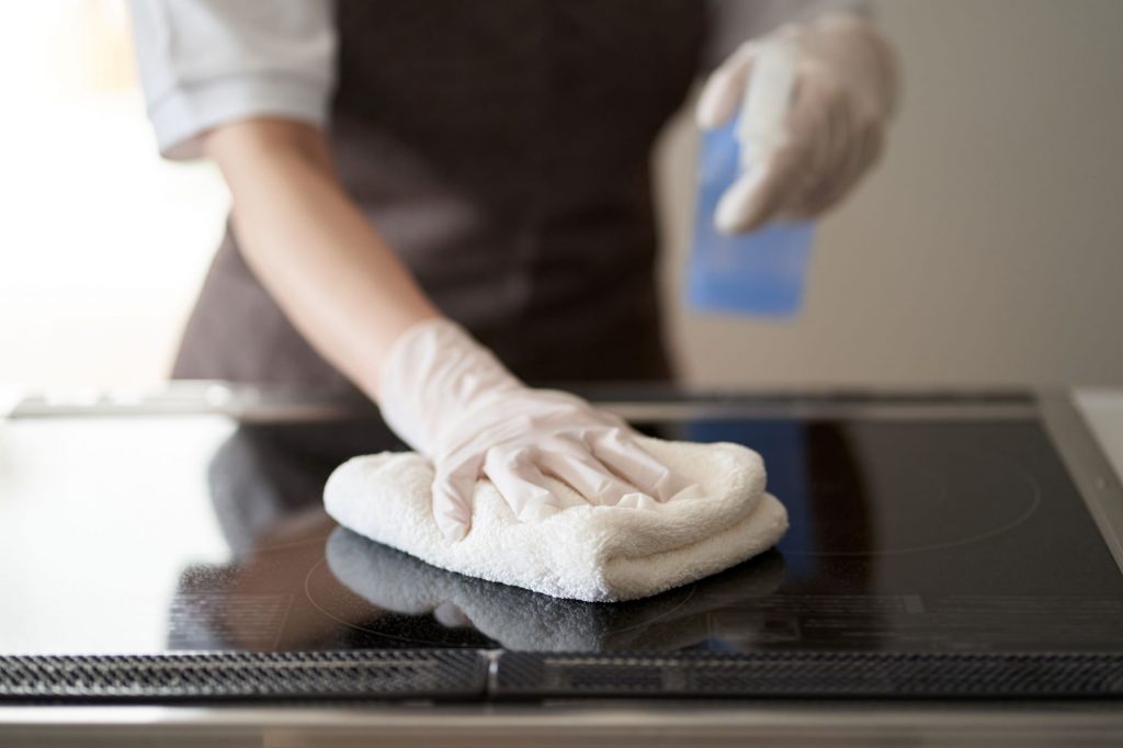 Housekeeping & Cleaning Services in Philly - Woman wiping a surface