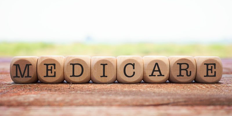 Why Doesn't Medicare Pay for Long-Term Care? Wooden blocks spelling out "Medicare."