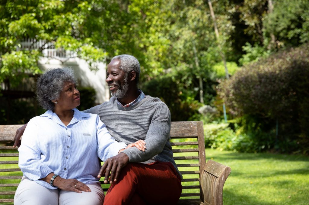 Loving couple on bench.