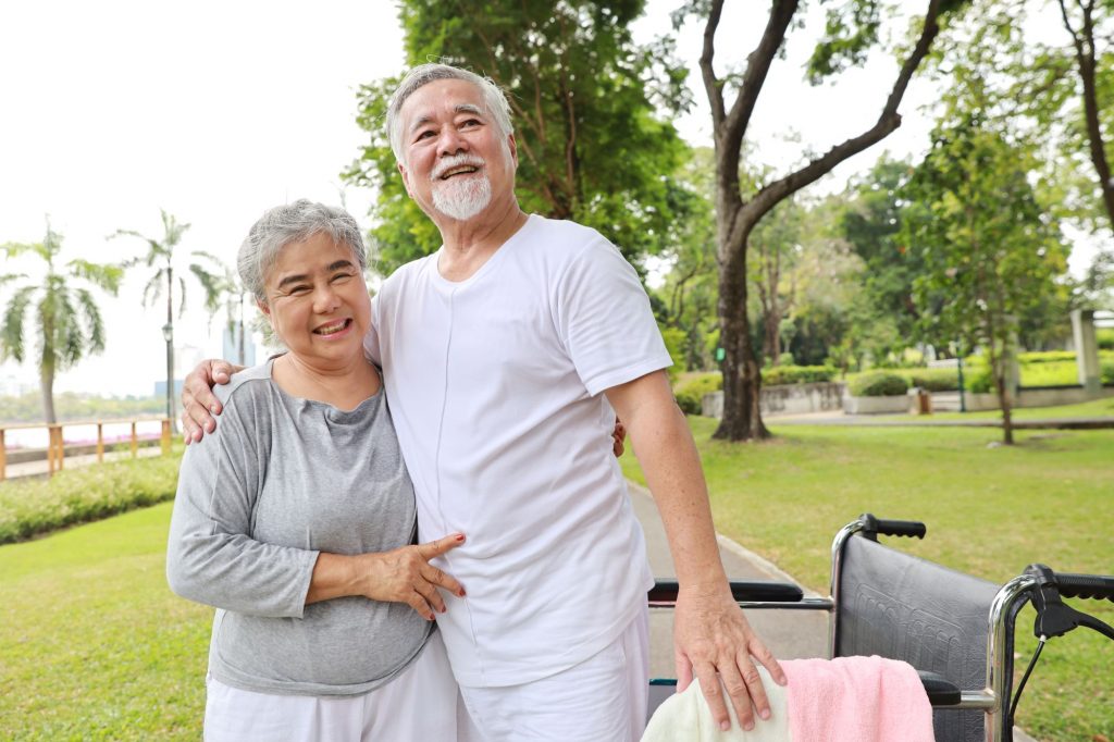 Asain senior couple with a wheelchair