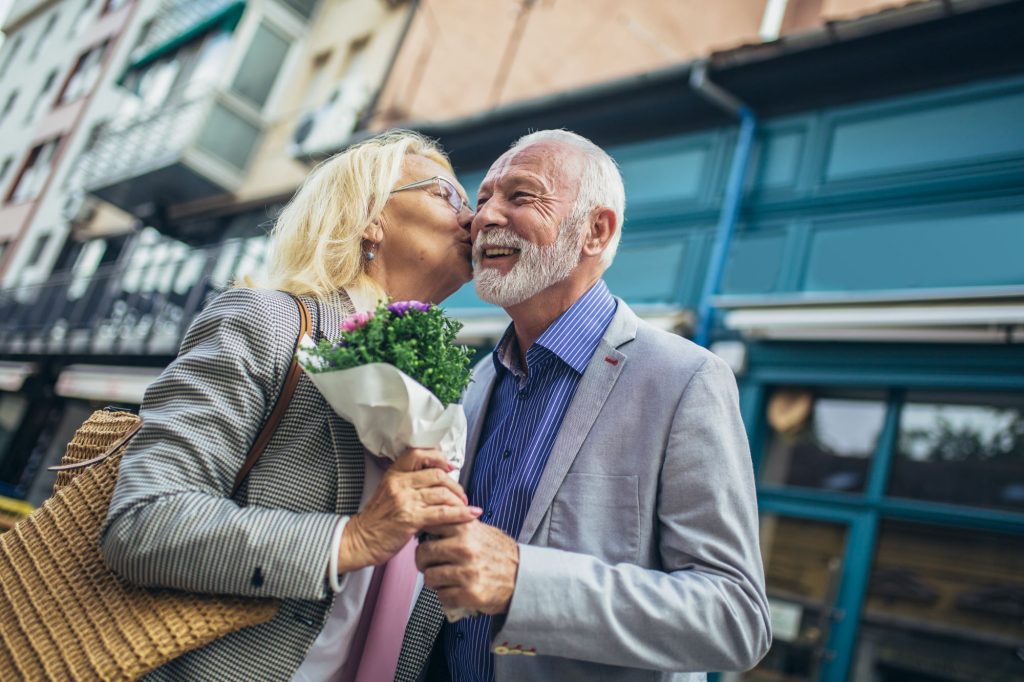 husband giving wife flowers