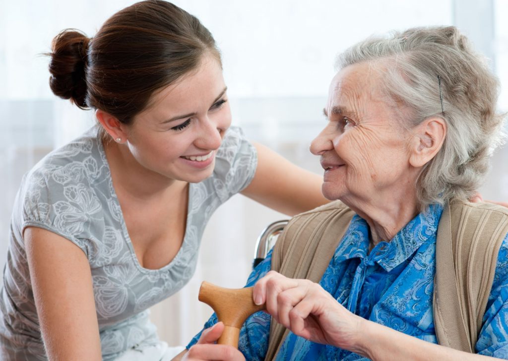 caregiver and senior adult woman
