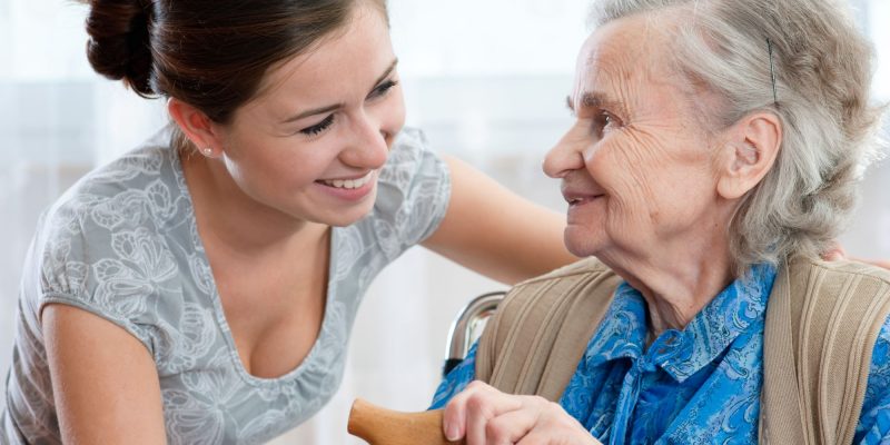 caregiver and senior adult woman
