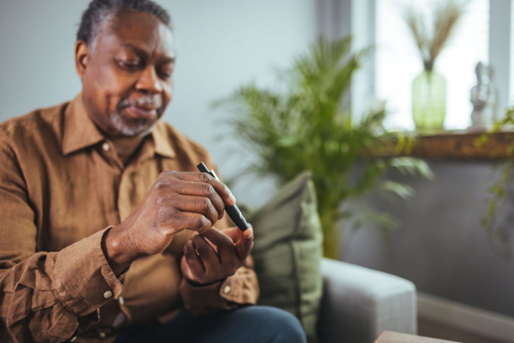 Did I Make a Mistake Changing My Medicare Supplement? African American man checking his glucose