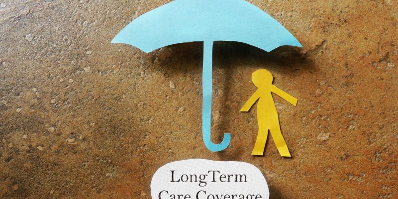 long term care coverage umbrella and stick person