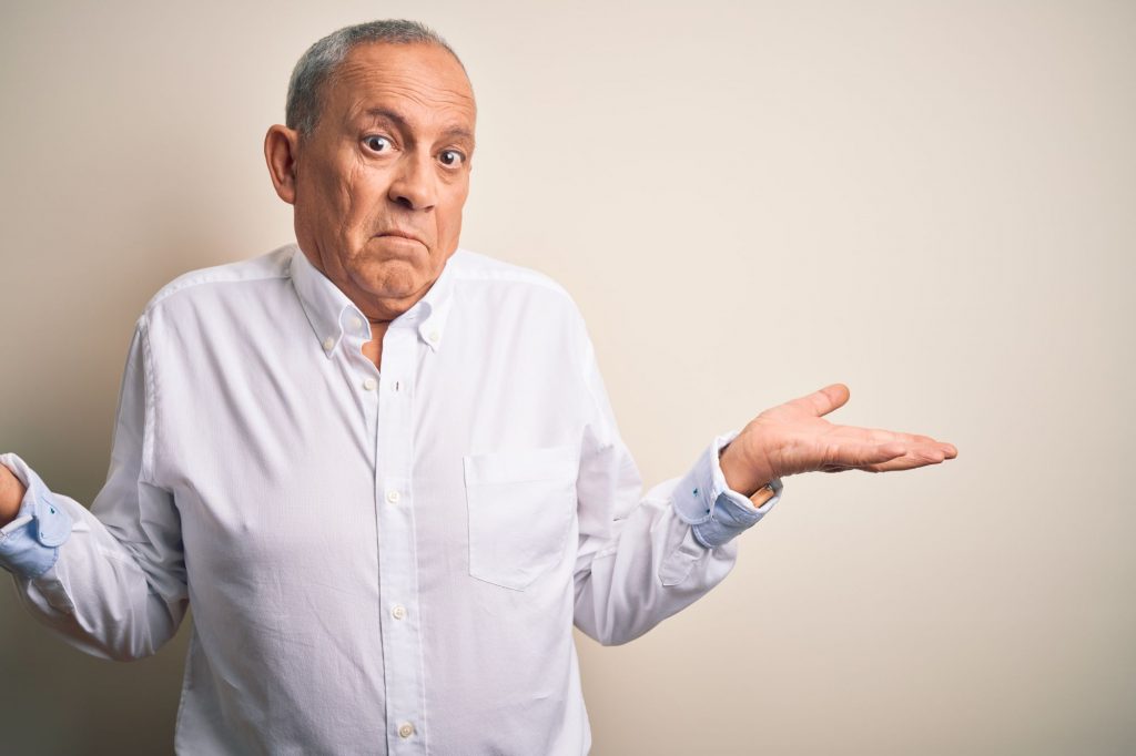 man shrugging, confused