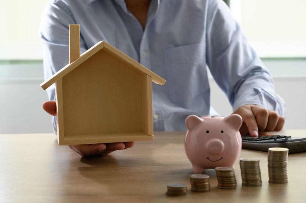 piggy bank and house - estate taxes