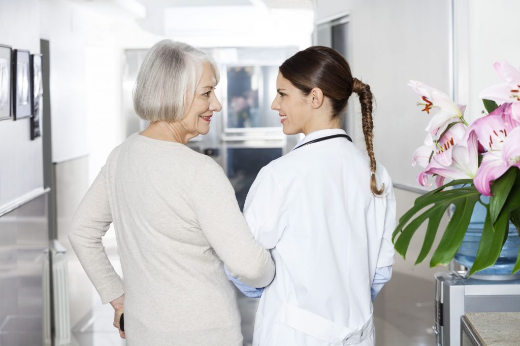 Ways to Pay for Long-Term Care Without Insurance or Savings cover photo of patient and nurse in assisted living facility