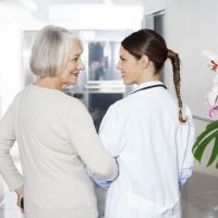 assisted living nurse and patient