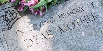 head stone with "in loving memory of dear mother"