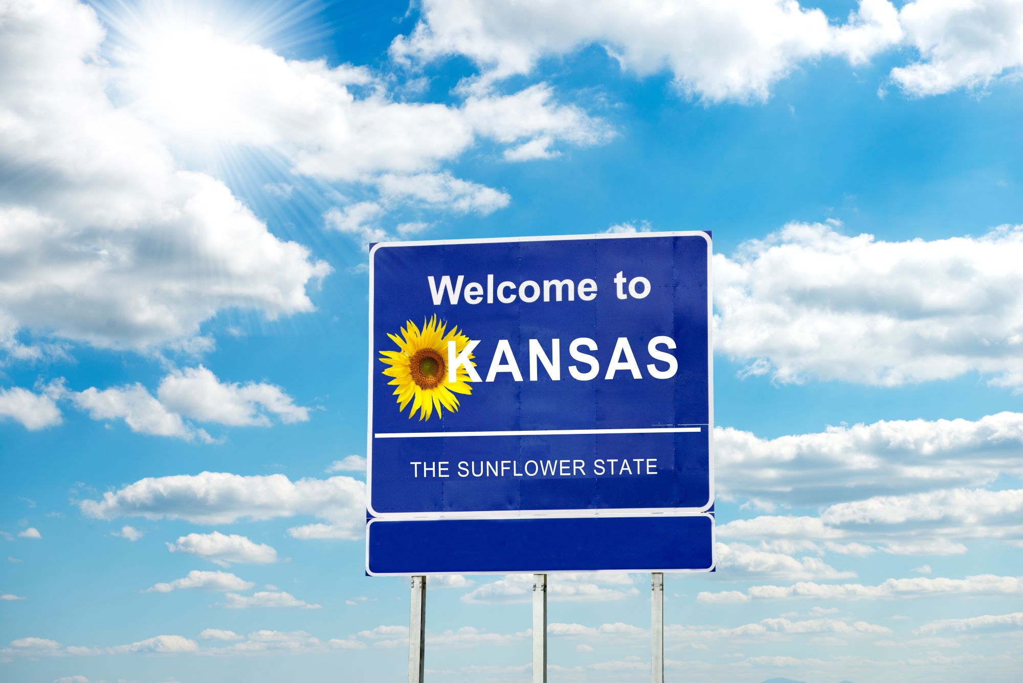 Welcome to Kansas street sign
