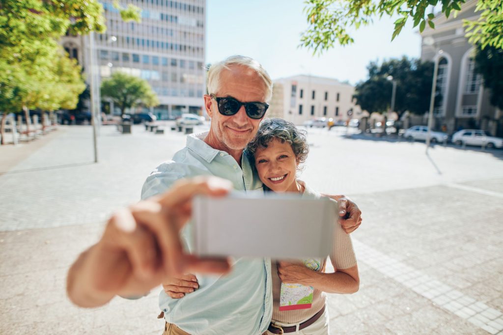 Grandparents snapping photos for their grandchildren. Grandparent.