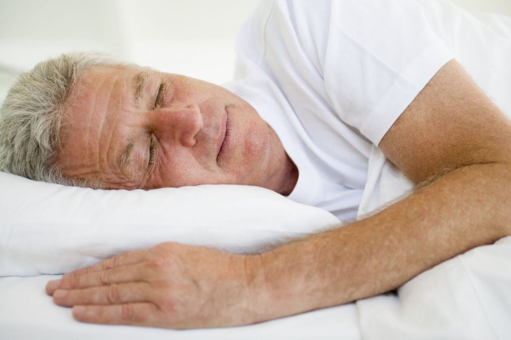 man sleeping on pillow