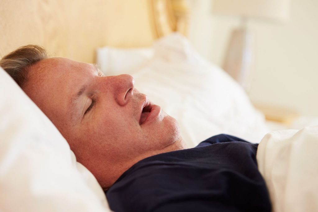 snoring man wth sleep apnea