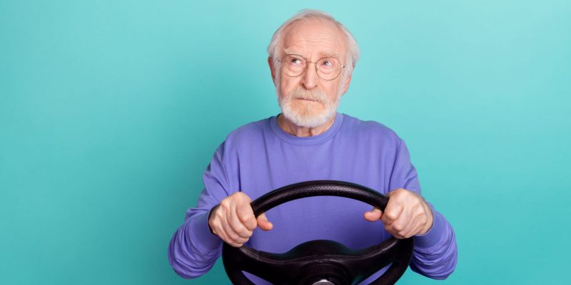 man holding a steering wheel