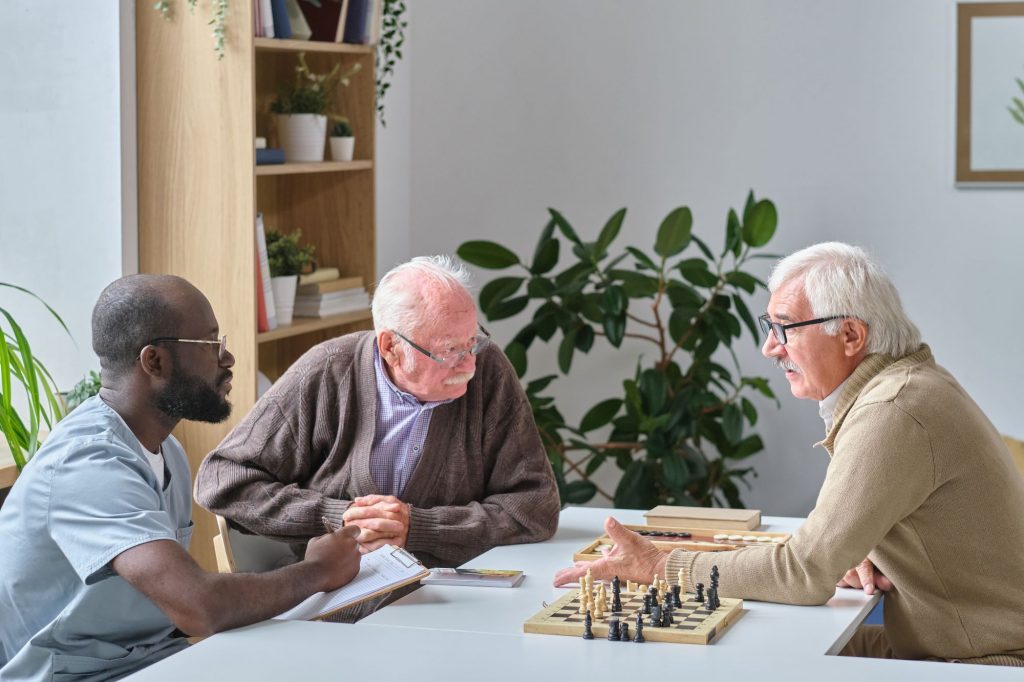 doctor playing chess with patients