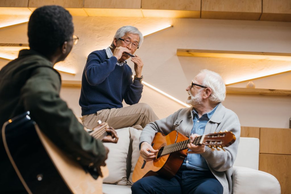 group of senior retiree friends playing music