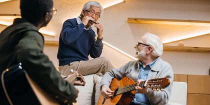 group of senior retiree friends playing music
