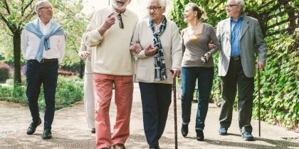 group of older adults walking outside